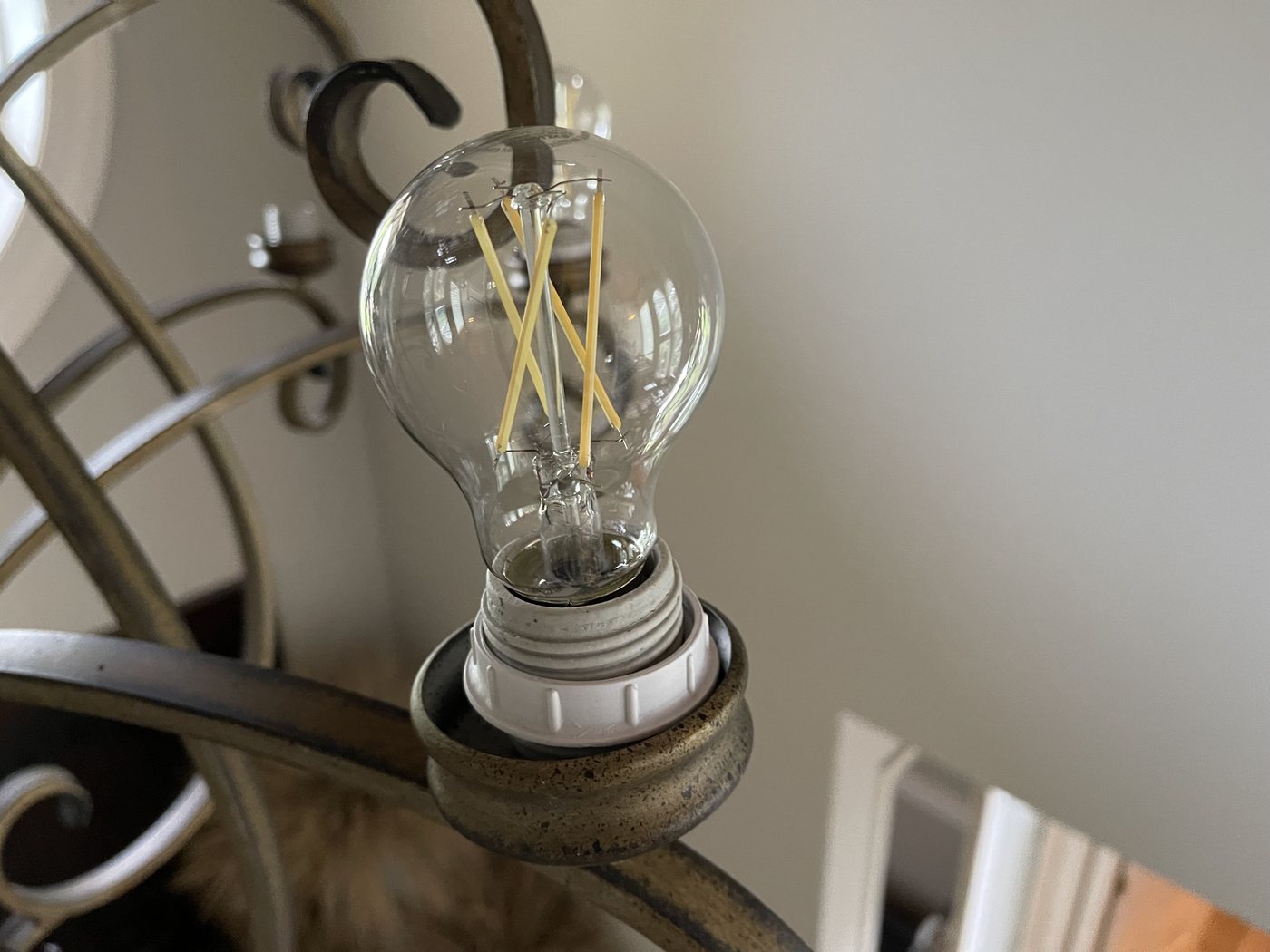 Clean filament bulb in a chandelier socket