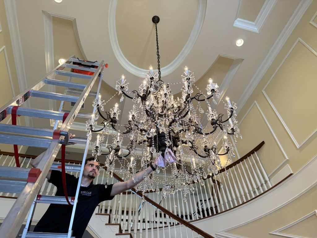 Cleaning a staircase chandelier
