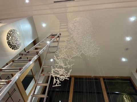 White glass burst installation
