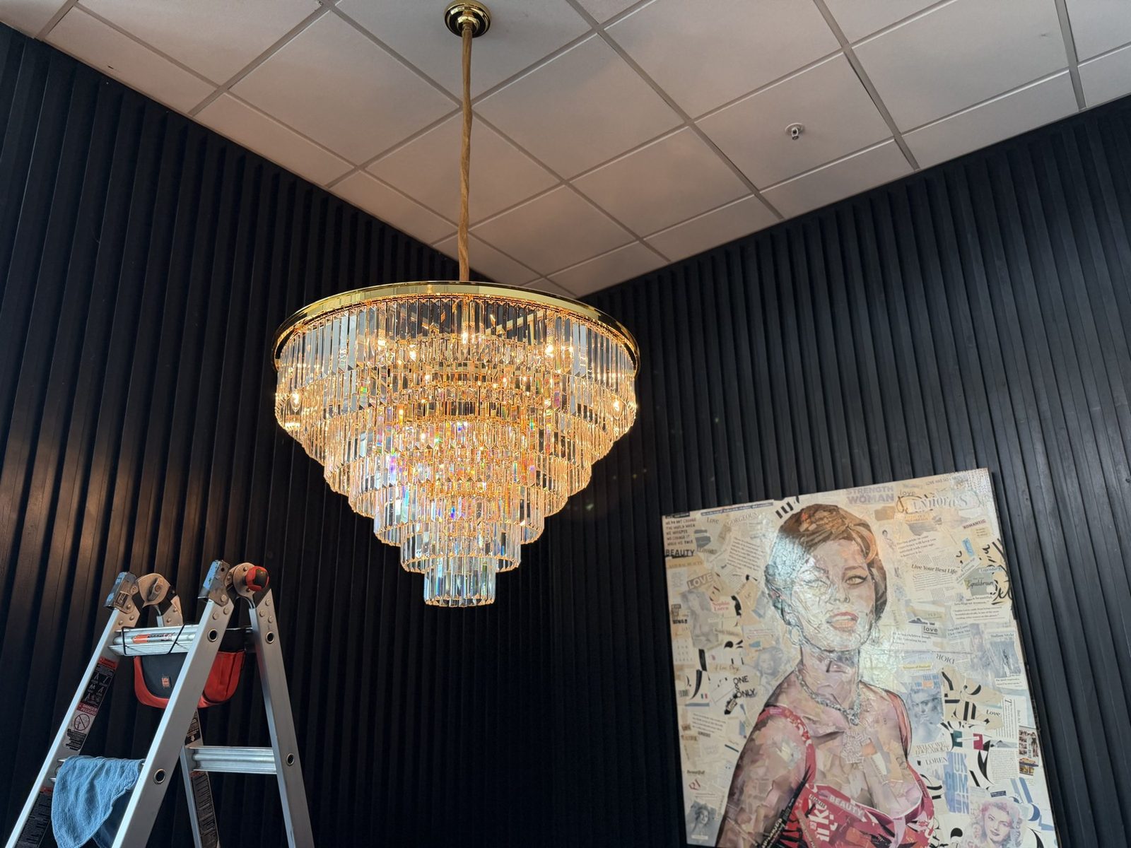 Grand gold-frame tiered crystal chandelier cleaned by Brightmen, Florida