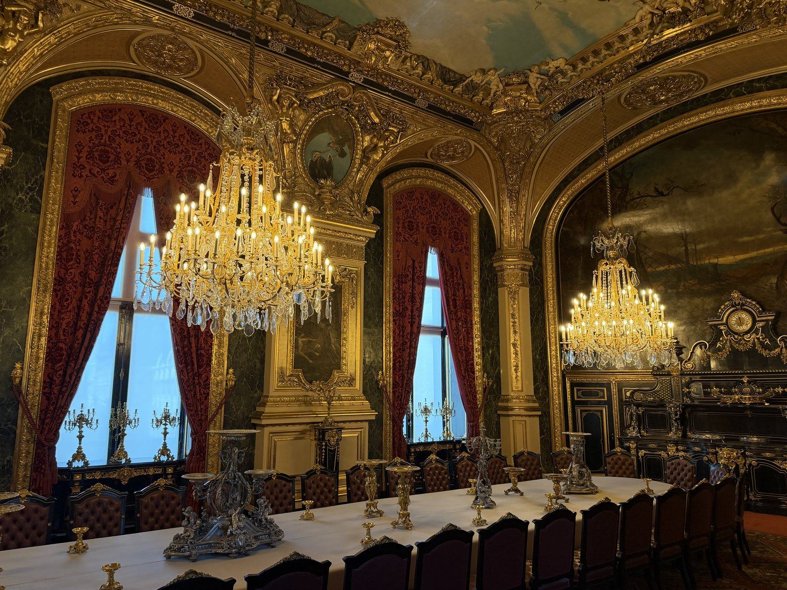 Grand gilded dining room with crystal chandeliers, the Louvre