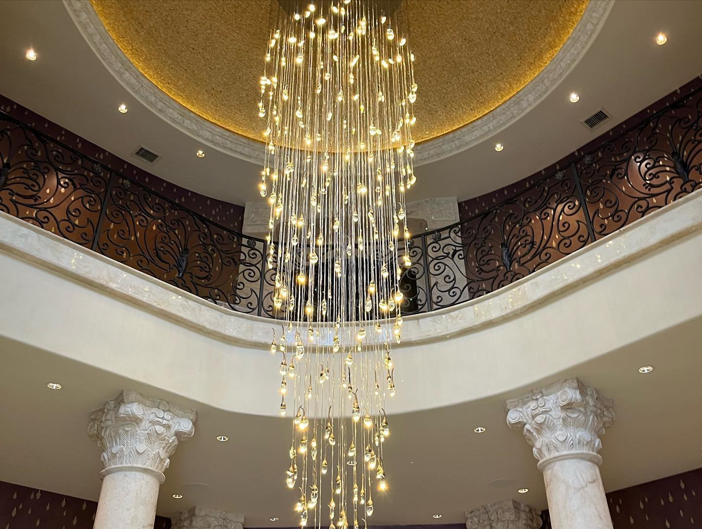 Cascading crystal chandelier in a domed rotunda
