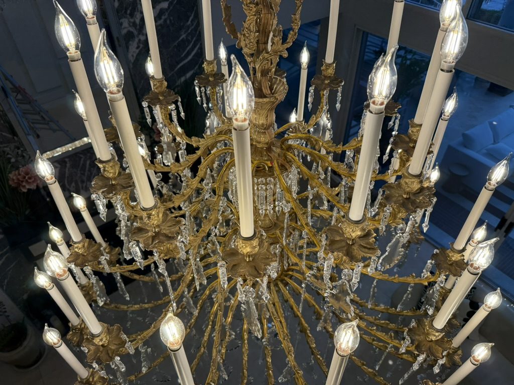 A grand gilt chandelier frame polished to a mirror bright finish